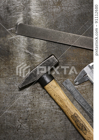 Set of various home tools lying in row on old metall background. Men's style. 91112680
