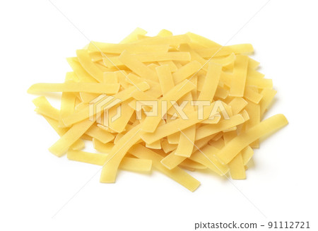 Pile of uncooked short cut ribbon pasta 91112721