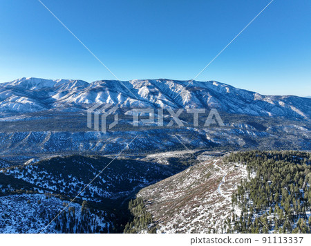 Aerial view over Big Bear Valey and Lake with now, South California, USA Aerial view over Big Bear Valey and Lake with now, South California, USA 91113337