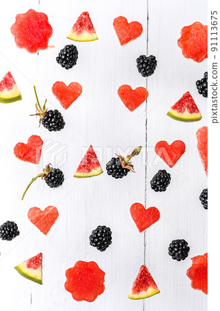 Background from autumn berries. Watermelon, figs, blackberries. Flat style. Top view 91113675