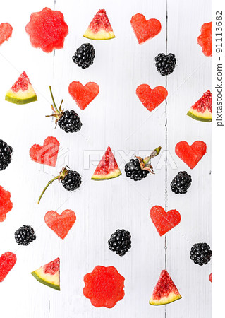 Background from autumn berries. Watermelon, figs, blackberries. Flat style. Top view 91113682