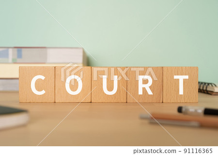 A desk with a block labeled "COURT" A desk with a block labeled "COURT" 91116365