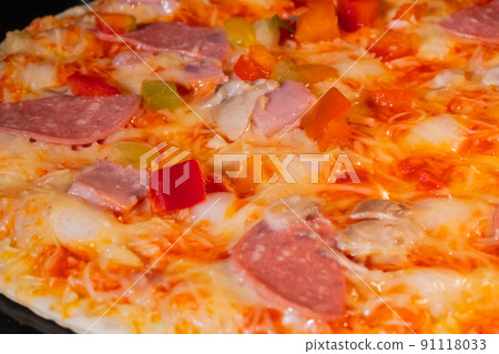 Baked homemade pizza in electric oven at home: close up 91118033