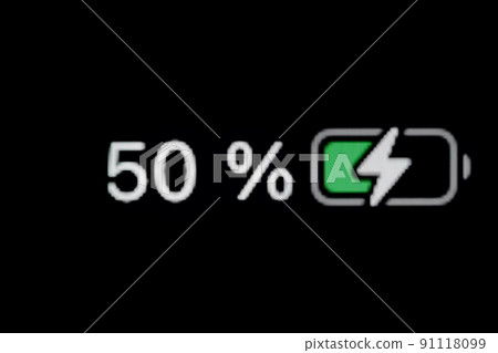 Smartphone charged battery level indicator - fifty, 50 percent: close up macro Smartphone charged battery level indicator - fifty, 50 percent: close up macro 91118099