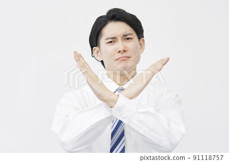 A businessman who stamps with his arm on a white background A businessman who stamps with his arm on a white background 91118757