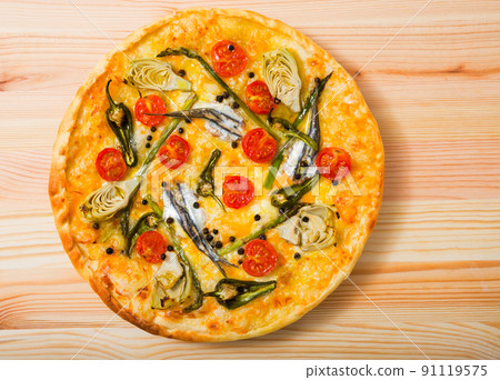 Pizza with anchovies, artichokes, cheese 91119575