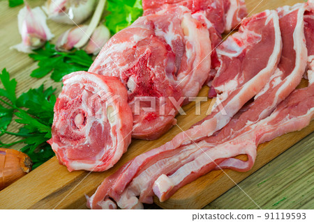 Raw lamb meat with vegetables Raw lamb meat with vegetables 91119593