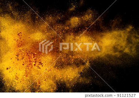 Explosion, Splashes of turmeric on a black background. India Seasoning. The orange powder of the turmeric root. 91121527