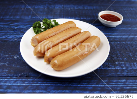 Frankfurt-like sausage with traditional German pork stuffed with parsley on the table 91126675