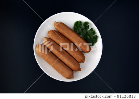 Frankfurt-like sausage with traditional German pork stuffed with parsley on the table Frankfurt-like sausage with traditional German pork stuffed with parsley on the table 91126818