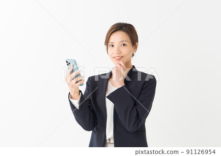 A woman with a smartphone, upper body 91126954