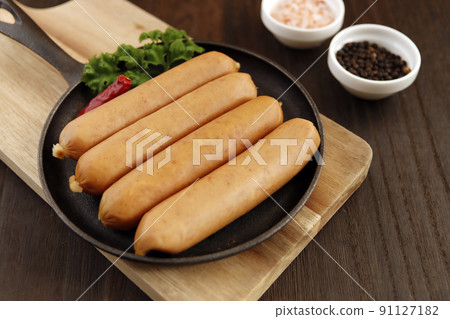 Frankfurt-like sausage with traditional German pork stuffed with parsley on the table 91127182