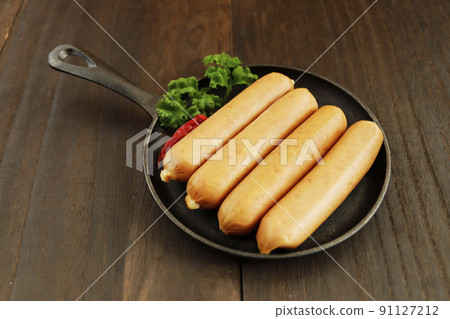 Frankfurt-like sausage with traditional German pork stuffed with parsley on the table Frankfurt-like sausage with traditional German pork stuffed with parsley on the table 91127212