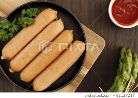 Frankfurt-like sausage with traditional German pork stuffed with parsley on the table 91127217
