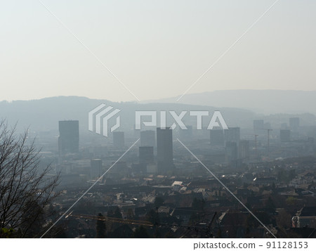 Zurich, Switzerland - March 26th 2022: View from Zuerichberg over the city with skyscrapers Zurich, Switzerland - March 26th 2022: View from Zuerichberg over the city with skyscrapers 91128153