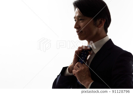 Middle man wearing a suit 91128796