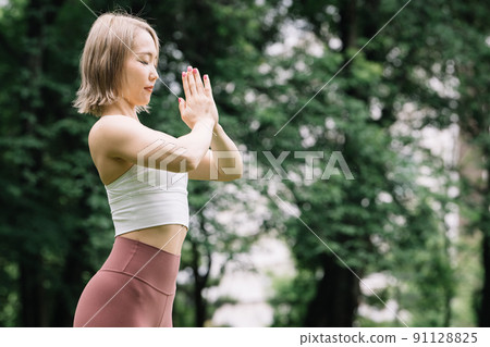 A young lad yoga outdoors A young lad yoga outdoors 91128825