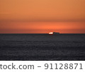 Sunset over the Atlantic Ocean and a cargo ship 3 91128871