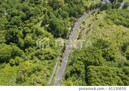Aerial view of Toya Nishiyama foot crater (destroyed old town road and old Toyako kindergarten) 91130650