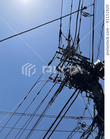 Telephone pole in the blue sky Telephone pole in the blue sky 91131920