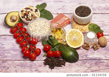 Balanced diet food background. Organic food for healthy nutrition, vegetables,hercules,olive oil,fish,herbs,nuts,dried fruits, seeds and greens Balanced diet food background. Organic food for healthy nutrition, vegetables,hercules,olive oil,fish,herbs,nuts,dried fruits, seeds and greens 91134339