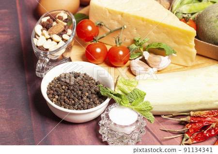 Vegetables and cheese on a wooden background. Vegetables and cheese on a wooden background. 91134341