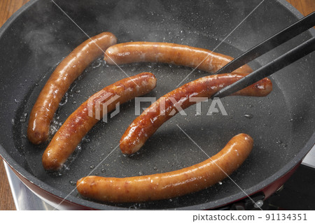 Baking sausages Baking sausages 91134351
