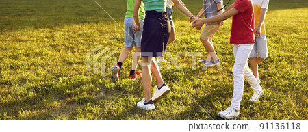 Group of little kids playing games, dancing in circle and having fun in the park Group of little kids playing games, dancing in circle and having fun in the park 91136118