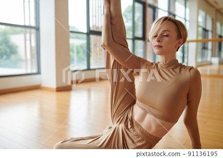 Young Woman Doing Stretching Exercise Young Woman Doing Stretching Exercise 91136195