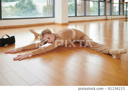 Flexible Woman Doing Side Splits Flexible Woman Doing Side Splits 91136215