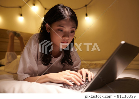 Girl Studying Late at Night 91136359