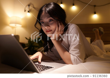 Teenage Girl Browsing the Internet Teenage Girl Browsing the Internet 91136360