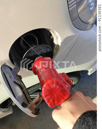 Refueling at a gas station 91136561