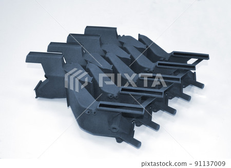 Models printed on 3D printer isolated on white background. Objects details printed on 3D printer from plastic close-up. Prototypes of shapes made by 3d printer. Concept new modern printing technology Models printed on 3D printer isolated on white background. Objects details printed on 3D printer from plastic close-up. Prototypes of shapes made by 3d printer. Concept new modern printing technology 91137009
