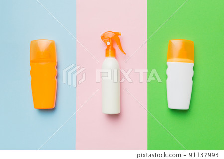 Skincare cosmetic products from above on colored table. Cream, cleancer, moisturizer or lotion. Branding mock up. Copyspace 91137993