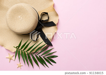 Summer holidays. Summer concept with straw hat and tropical leaf. Flat lay, top view, copy space Summer holidays. Summer concept with straw hat and tropical leaf. Flat lay, top view, copy space 91138015