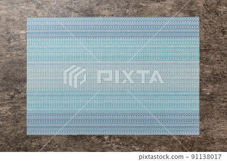 Top view of blue tablecloth for food on cement background. Empty space for your design Top view of blue tablecloth for food on cement background. Empty space for your design 91138017