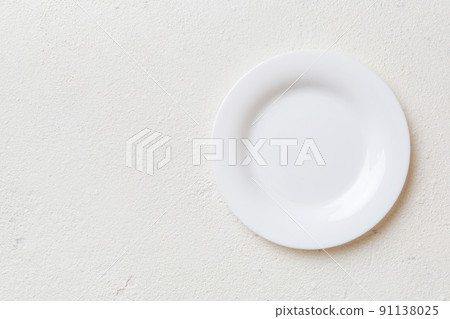 Top view of empty light plate on cement background. Empty space for your design 91138025