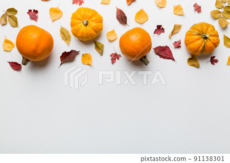 Autumn composition. Pattern made of dried leaves and other design accessories on table. Flat lay, top view Autumn composition. Pattern made of dried leaves and other design accessories on table. Flat lay, top view 91138301
