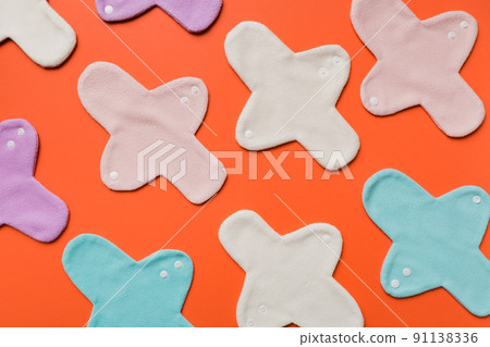 Eco-friendly reusable fabric women's pads. set of colorful bright reusable menstrual pads. zero waste woman periods concept top view with copy space Eco-friendly reusable fabric women's pads. set of colorful bright reusable menstrual pads. zero waste woman periods concept top view with copy space 91138336