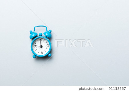 Alarm clock isolated on colored background with copy space top view Alarm clock isolated on colored background with copy space top view 91138367