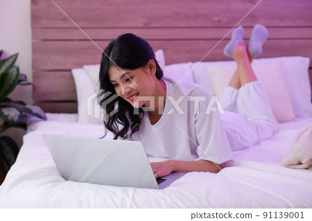 Girl Relaxing on Bed Girl Relaxing on Bed 91139001