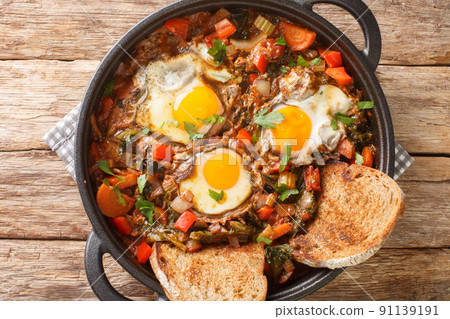 Acquacotta is a delicious tuscan soup originally from Maremma close up in the pot. Horizontal top view Acquacotta is a delicious tuscan soup originally from Maremma close up in the pot. Horizontal top view 91139191