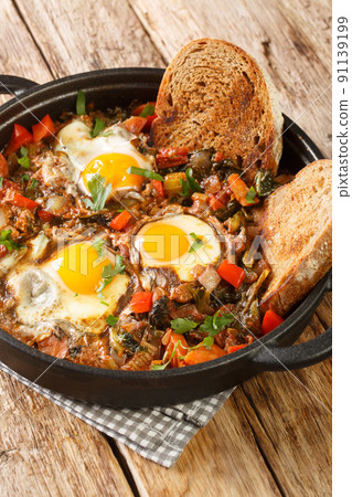 Acquacotta Maremmana Tuscan Vegetable Soup with eggs close up in the pot. Vertical Acquacotta Maremmana Tuscan Vegetable Soup with eggs close up in the pot. Vertical 91139199