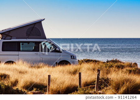 Camper van with roof top tent camp on beach Camper van with roof top tent camp on beach 91141264