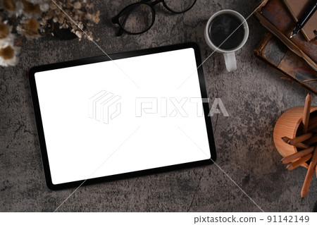 Flay lay digital tablet, eyeglasses, coffee cup and book on creative workspace 91142149