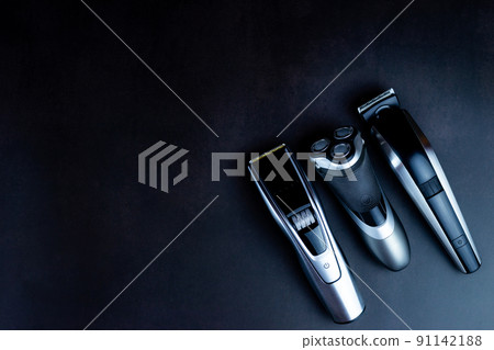 hair clipper black background. hair clipper black background. 91142188