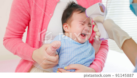 asian doctor examine baby fever asian doctor examine baby fever 91145887