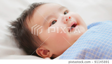 baby lying on the bed baby lying on the bed 91145891