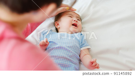 mother with her baby mother with her baby 91145892